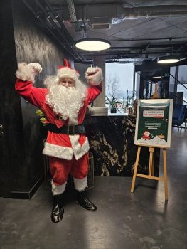 Santa Claus posing inside Matex Transport office during Christmas event – festive company celebration